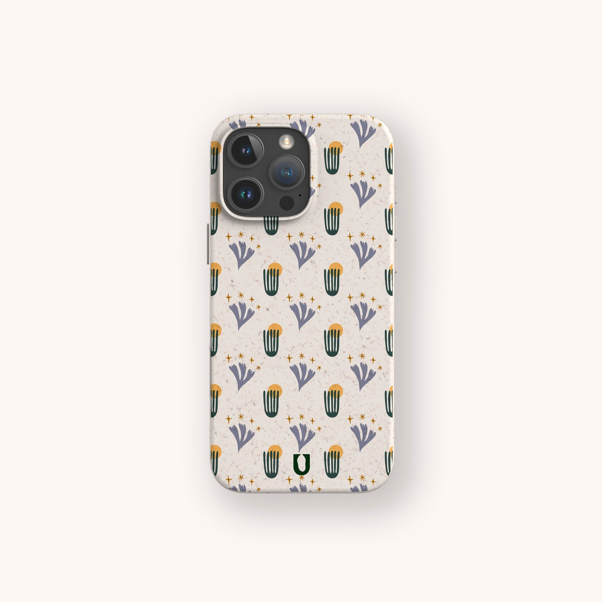 The Sunny Side Up Eco-Friendly Phone Case, in beige with a cactus and purple flower pattern accented by small yellow stars, is displayed on a light background.