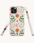 The Sun and the Moon Eco-Friendly Phone Case features a vibrant celestial design on a white background, with suns with faces, green snakes, crescent moons, stars, and small flowers. Three different angles of this compostable phone case are displayed against a plain backdrop.