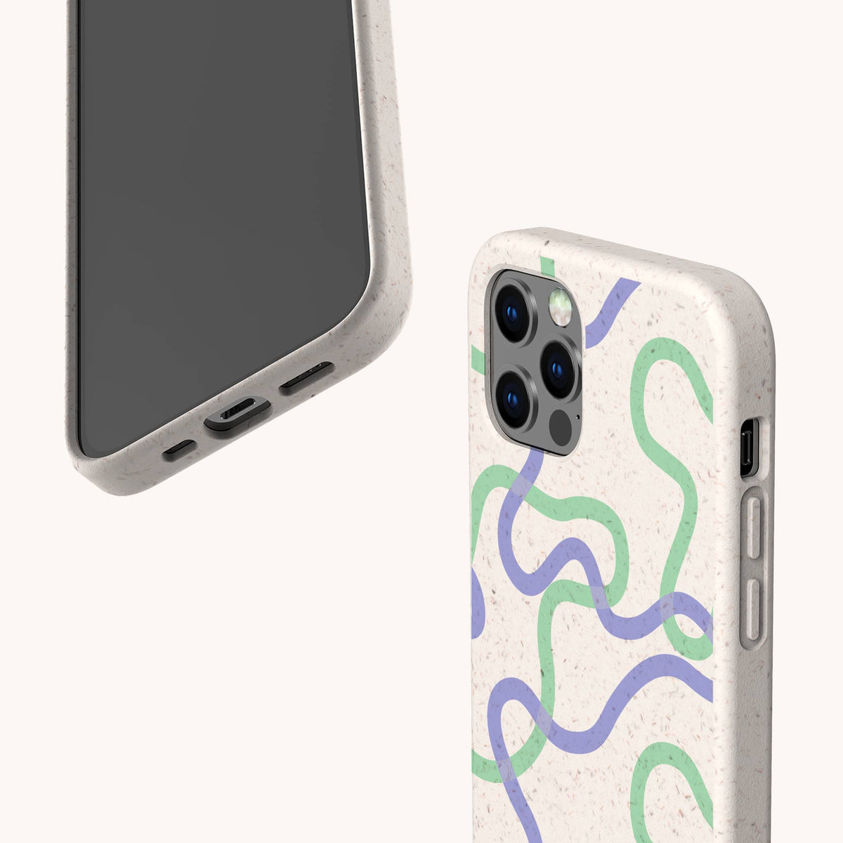 Two smartphones in Purple and Green Swirls Eco-Friendly Biodegradable Phone Cases featuring abstract blue, green, and purple wavy line designs on a beige speckled background. One phone displays the case’s back with the camera cutouts, while the other shows the screen and charging port.