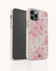 A smartphone with the Pink Roses Eco-Friendly Phone Case in white, featuring a pink floral pattern, displayed standing upright and slightly turned to showcase both the screen and the back design.