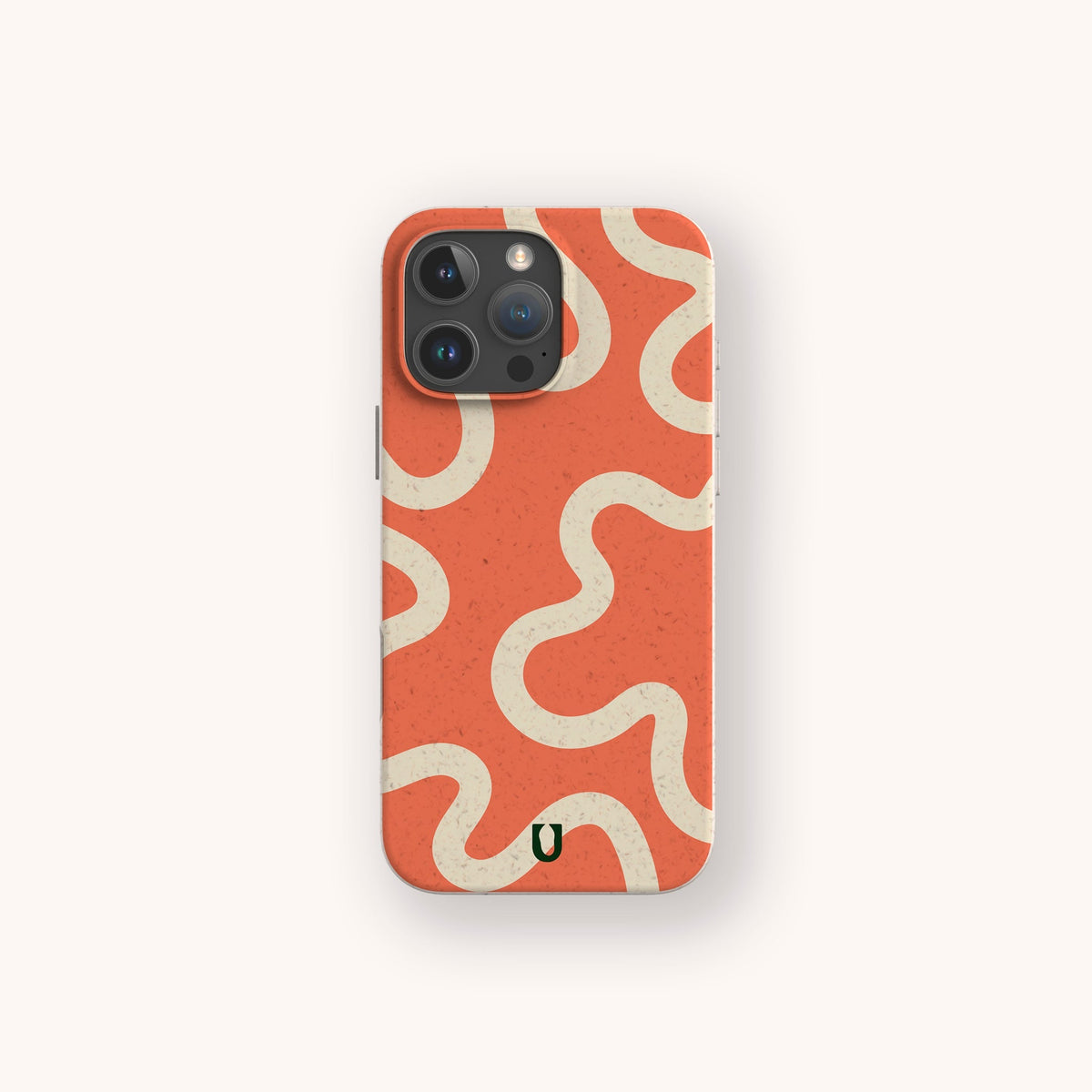 A smartphone with the Orange Swirl Eco-Friendly Biodegradable Phone Case, featuring wavy, cream-colored lines and a small black U logo at the bottom, displayed against a plain off-white background.