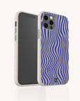 Two Cobalt Distort Lines Eco-Friendly Phone Cases—one revealing the phone screen and the other highlighting a blue and beige wavy striped design—crafted from speckled, sustainable materials. These eco-friendly cases are designed to fit both iPhone and Samsung Galaxy models.