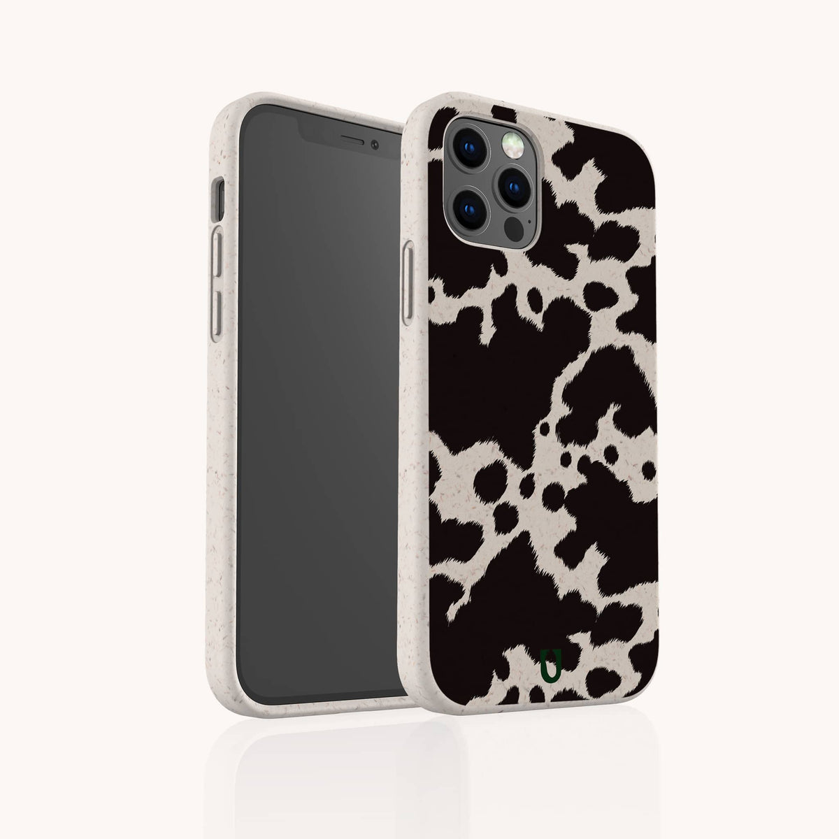 A Cow Print Eco-Friendly Phone Case featuring a black and white cow pattern is displayed from both front and back angles against a plain white background. The case has a textured look, offers full coverage for all sides of the phone, and is compatible with iPhone and Samsung models.