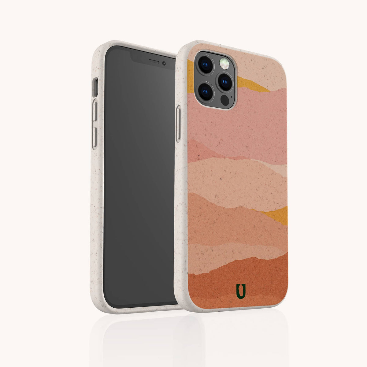 Smartphone in the Mountains Eco-Friendly Phone Case, which features a multicolored, abstract wavy design in pink, peach, and orange tones. The case has a speckled texture, a small green logo at the bottom, and is compatible with both iPhone and Samsung devices.