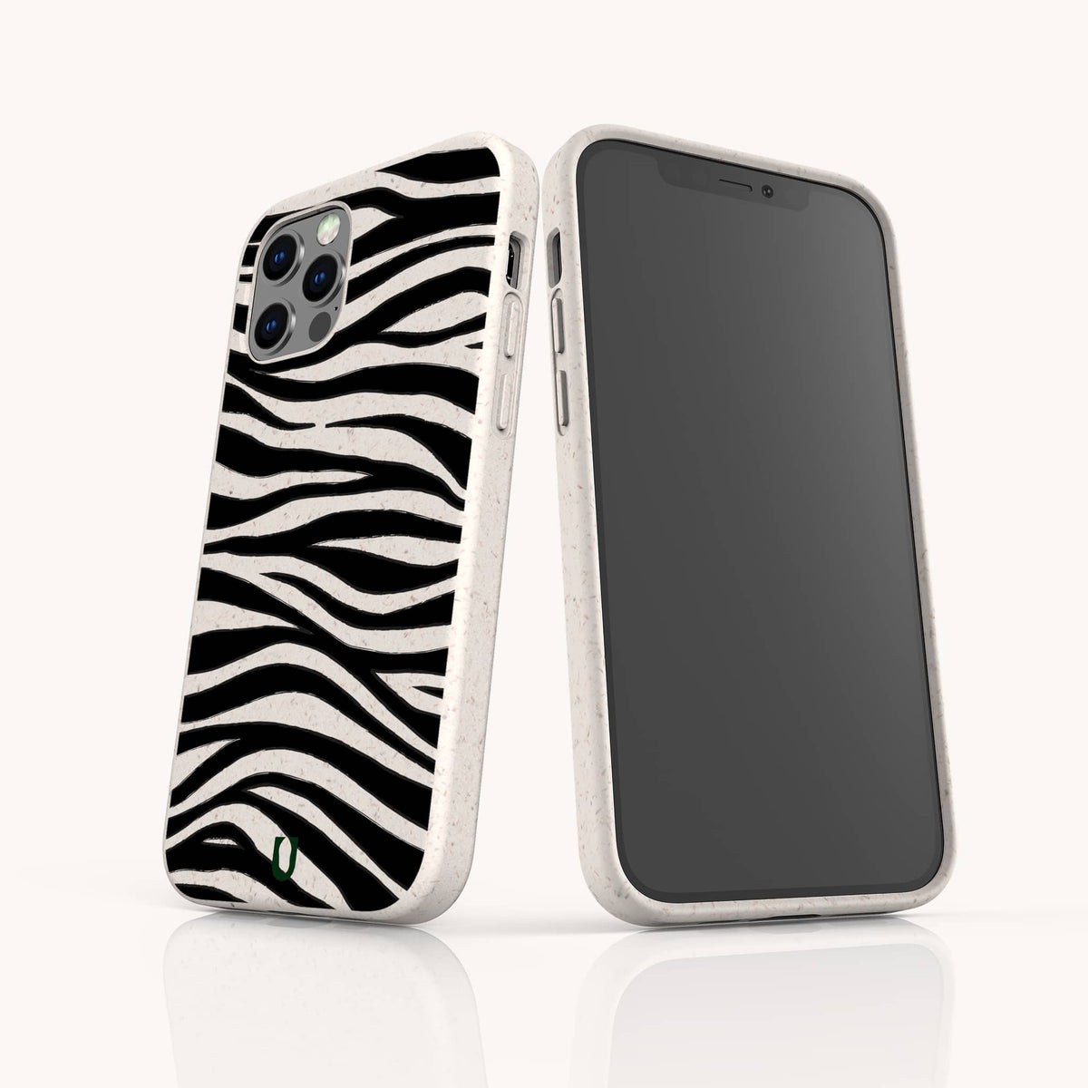 Two Zebra Eco-Friendly Phone Cases in bold black zebra stripe patterns and white finish are shown—one displaying the back, the other the front. Each case features a small green leaf logo at the bottom, emphasizing its eco-friendly design. The background is plain white.