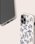 Two phone cases are shown; one displays the screen, while the other is the Turtles Eco-Friendly Phone Case, featuring a charming pattern of blue sea turtles on a white background. Both cases are crafted from sustainable materials and have cutouts for buttons and ports.