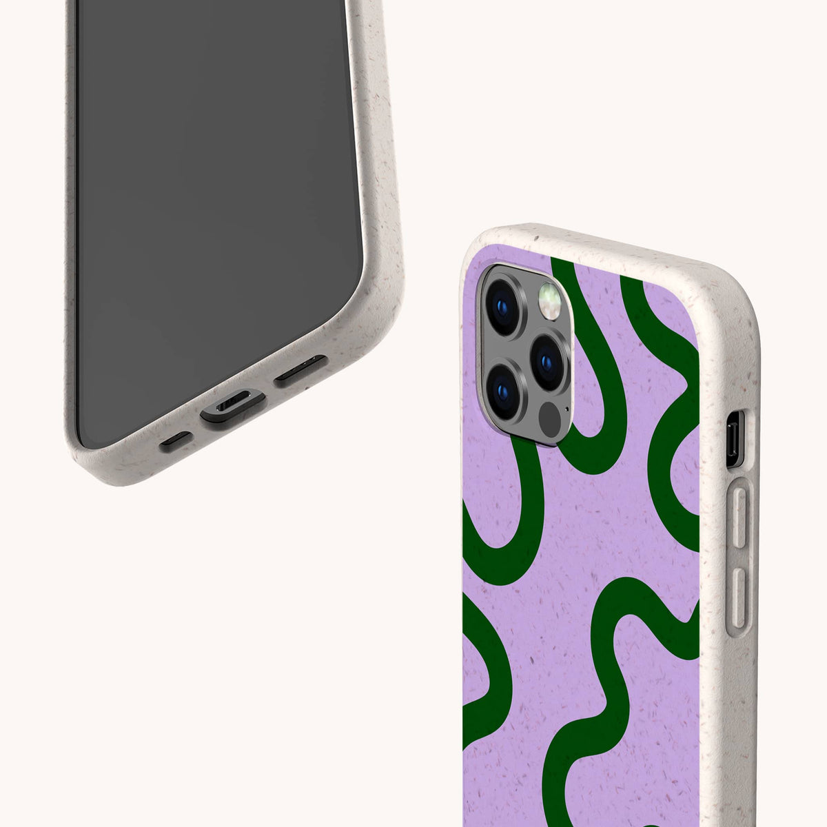 Two smartphones display the Purple and Green Swirl Eco-Friendly Biodegradable Phone Case in beige, with one showcasing a pink back accented by green swirls, photographed from both front and back angles. Both cases highlight accessible side and bottom ports and are crafted from an eco-friendly, biodegradable material for a stylish look that’s gentle on the planet.