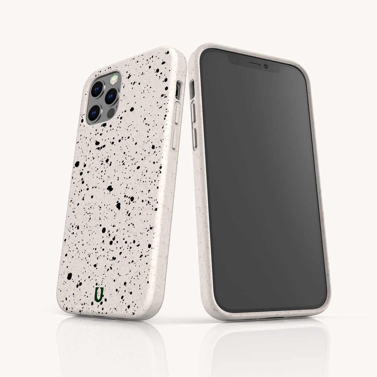 Two smartphones with Black Splatter Eco-Friendly Phone Cases in white, featuring black paint splatter patterns, are displayed standing upright—one showing the front and one showing the back—against a white background.