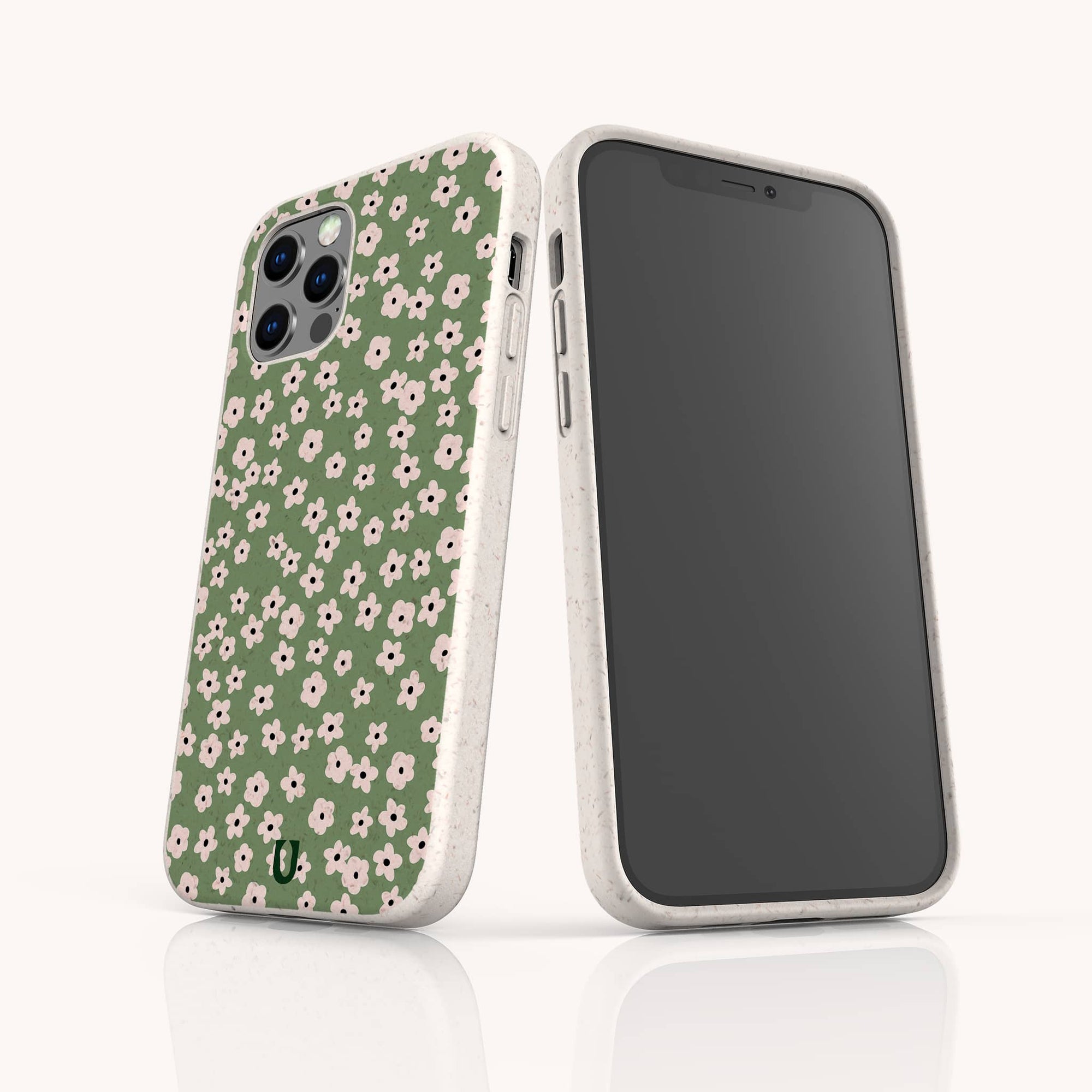 Two smartphones in white cases with a green back featuring pink and white floral designs; one shows the front screen, the other displays the Vintage Green Flowers Eco-Friendly Phone Case.
