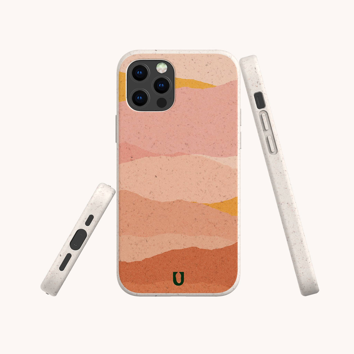 Three views of a phone in the Mountains Eco-Friendly Phone Case, featuring an abstract, wavy desert design in pink, peach, and ochre tones. The case is light speckled beige with rounded edges and simple button placements, and is compatible with both iPhone and Samsung models.