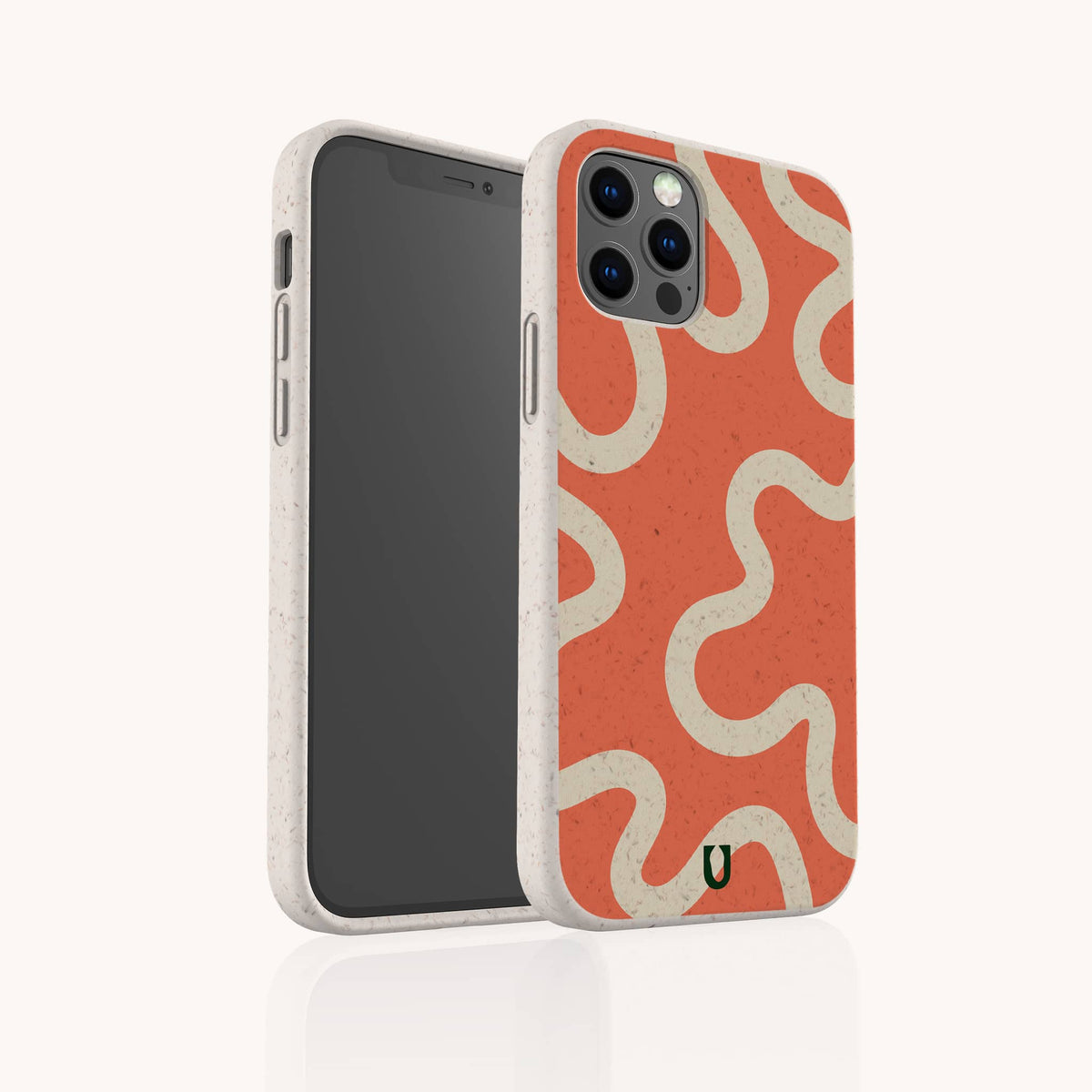 The Orange Swirl Eco-Friendly Biodegradable Phone Case is displayed upright on a smartphone, showcasing its beige and orange wavy cream pattern. The case features visible camera lenses and screen, along with a small green U-shaped logo at the bottom. This stylish accessory combines sustainability with vibrant, eye-catching design.