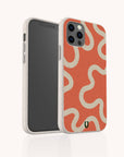 The Orange Swirl Eco-Friendly Biodegradable Phone Case is displayed upright on a smartphone, showcasing its beige and orange wavy cream pattern. The case features visible camera lenses and screen, along with a small green U-shaped logo at the bottom. This stylish accessory combines sustainability with vibrant, eye-catching design.