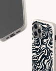The Black Marble Swirl Eco-Friendly Phone Case features a black and white wavy, abstract pattern. Displayed from both the front and back, it highlights details such as the camera cutout and charging port.
