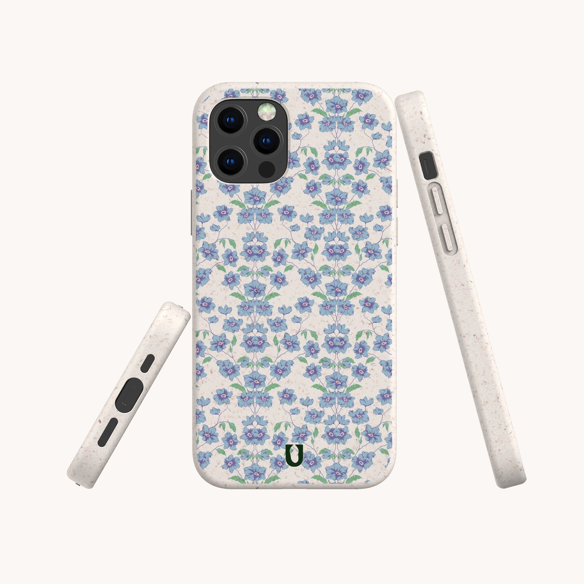 Three views of the Blue Ditsy Flowers Eco-Friendly Biodegradable Phone Case, featuring a blue and purple floral pattern on white, displayed from the back, side, and bottom angles. Made from biodegradable materials.