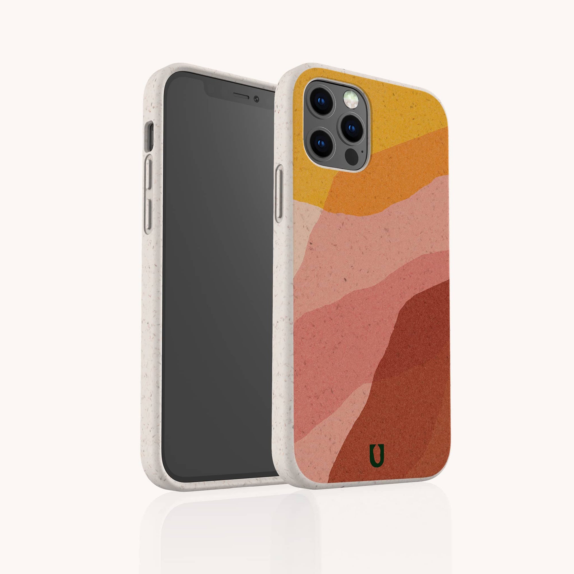 The Cliffs Eco-Friendly Phone Case, shown on a smartphone, features a beige textured abstract design with wavy orange, pink, and red layers in warm earth tones. Compatible with iPhone and Samsung Galaxy; front and back views are visible.