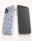 Two smartphones in Blue Marble Swirl Eco-Friendly Phone Cases—white, compostable cases with blue wavy abstract patterns; one phone displays the camera side, while the other shows the screen. Each case features a small green and black logo at the bottom.