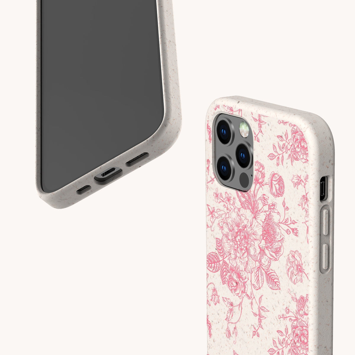 Showcased are two smartphones with eco-friendly beige cases; one reveals the screen, while the other displays the “Pink Roses Eco-Friendly Phone Case” featuring a beautiful pink floral pattern on the back. Both cases have a speckled texture and precise cutouts for buttons and ports.