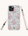 Introducing the Pink and Blue Coquette Flowers Eco-Friendly Biodegradable Phone Case, featuring a pastel floral pattern with pink flowers, blue bows, and green leaves. Showcased from the back and sides on a light background, this sustainable phone case offers a delicate, vintage-inspired design—ideal for those who value both elegant style and environmentally conscious choices.