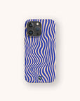 A Cobalt Distort Lines Eco-Friendly Phone Case, featuring blue and beige wavy stripes in an optical illusion design, is shown on a smartphone (compatible with both iPhone and Samsung Galaxy), centered against a plain, light background.