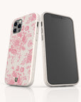 Two smartphones in Pink Roses Eco-Friendly Phone Cases featuring a white background with pink rose patterns. One phone displays the back of the case with its camera, while the other shows the blank screen. Both eco-friendly cases have a subtle speckled texture.
