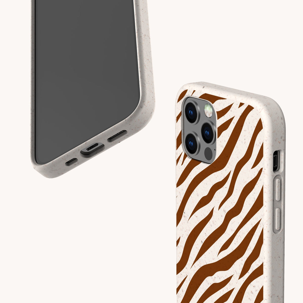 Two smartphones in beige speckled cases; one reveals the screen, while the other showcases the Brown Zebra Eco-Friendly Phone Case’s bold brown and white zebra stripe pattern on the back. Both offer precise cutouts for buttons and ports, making these sustainable cases as fashionable as they are environmentally conscious.