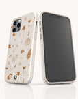 Two smartphones showcase the Summer Jam Eco-Friendly Phone Case in white, adorned with gold beach-themed illustrations such as palm trees, seashells, drinks, and flip-flops. One phone displays the front screen while the other highlights the stylish and sustainable back design, ideal for those who value both fashion and eco-conscious choices.