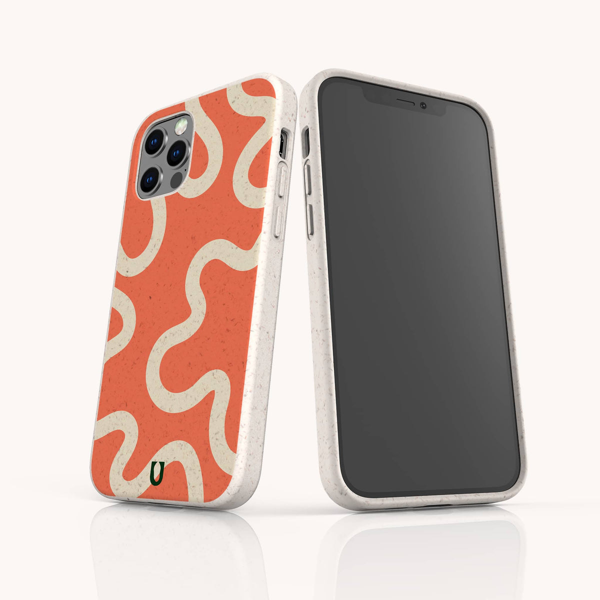Two smartphones in white speckled cases; one features the Orange Swirl Eco-Friendly Biodegradable Phone Case with wavy cream lines, while the other displays a blank screen. These Sustainable Phone Cases offer rounded edges and an eco-friendly texture.