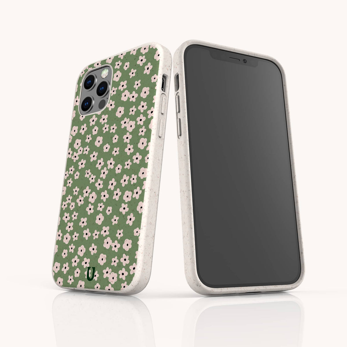 Two smartphones in white cases, one displaying the front screen and the other showcasing the back, which features the Vintage Green Flowers Eco-Friendly Phone Case—a design with a green background adorned with a white and pink floral pattern, perfect for anyone seeking vintage floral charm in an eco-friendly phone case.