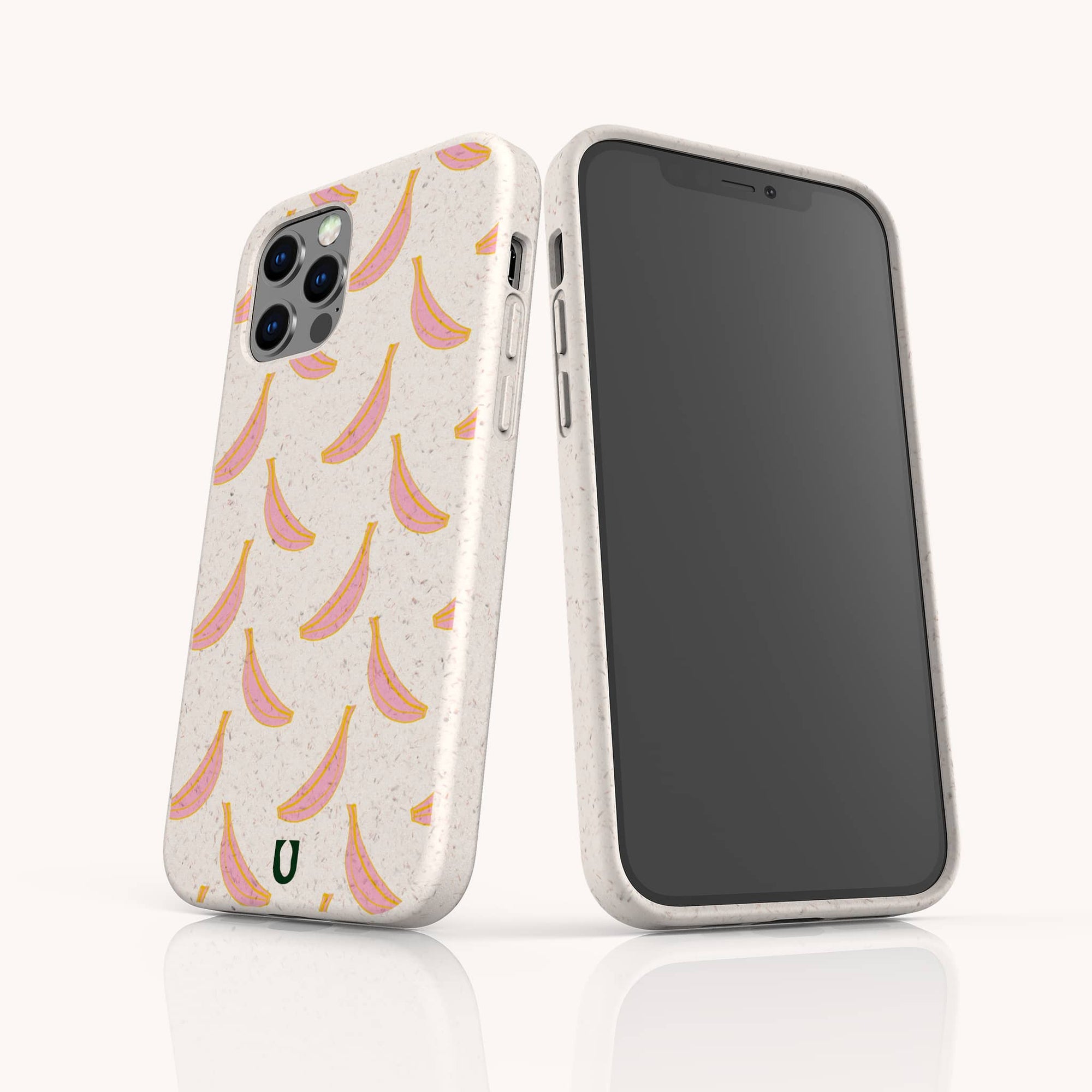 The Pink Bananas Eco-Friendly Phone Case, shown on iPhone and Samsung Galaxy models, features a pink and yellow banana pattern on an off-white, biodegradable case. One displays the design; the other shows the phone's front.
