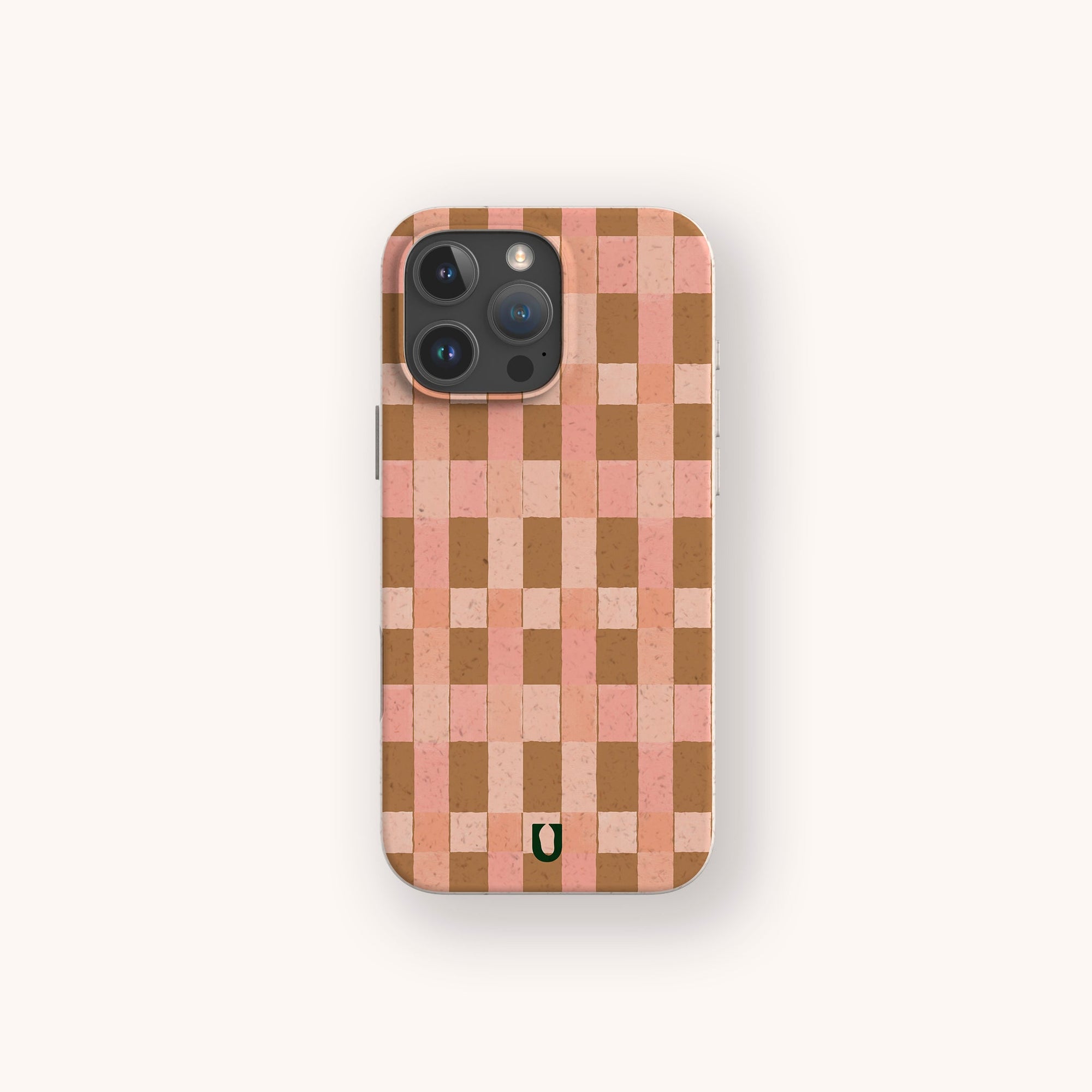 The Pink and Brown Watercolour Checker Eco-Friendly Phone Case protects your phone, featuring a pink and brown checker pattern with a small green horseshoe logo at the bottom and fits phones with a camera in the top left corner.