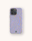 A smartphone with the Blue Distort Lines Eco-Friendly Phone Case, featuring wavy blue and beige stripes and a small horseshoe symbol at the bottom, displayed on a plain light background.
