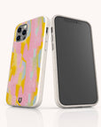 Two smartphones in white Mango Sorbet Eco-Friendly Phone Cases; one displays a colorful abstract pattern in pink, yellow, and blue, while the other shows a blank black screen. Both cases feature a small horseshoe logo at the bottom.